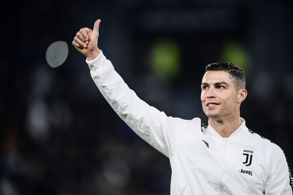 Juventus' Portuguese forward Cristiano Ronaldo gestures prior to the Italian Serie A football match Juventus vs Spal 2013 on November 24, 2018 at the Juventus stadium in Turin. / AFP / Marco BERTORELLO