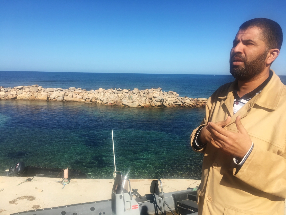 Coastguard official Ayman al-Dabbashi is seen on the seafront at the Libyan city of Sabratha, Libya November 21, 2018. Picture taken November 21, 2018. REUTERS/Aidan Lewis
