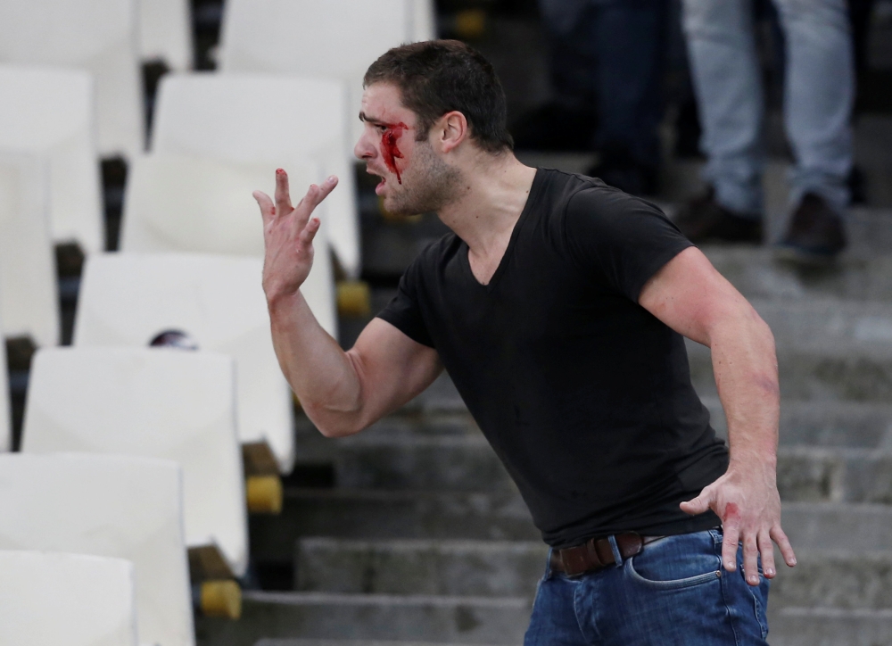 General view of an Ajax fan reacting after clashing with riot ploice in the stadium before the team’s match against AEK Athens, Athens, Greece, November 27, 2018. Reuters/Costas Baltas