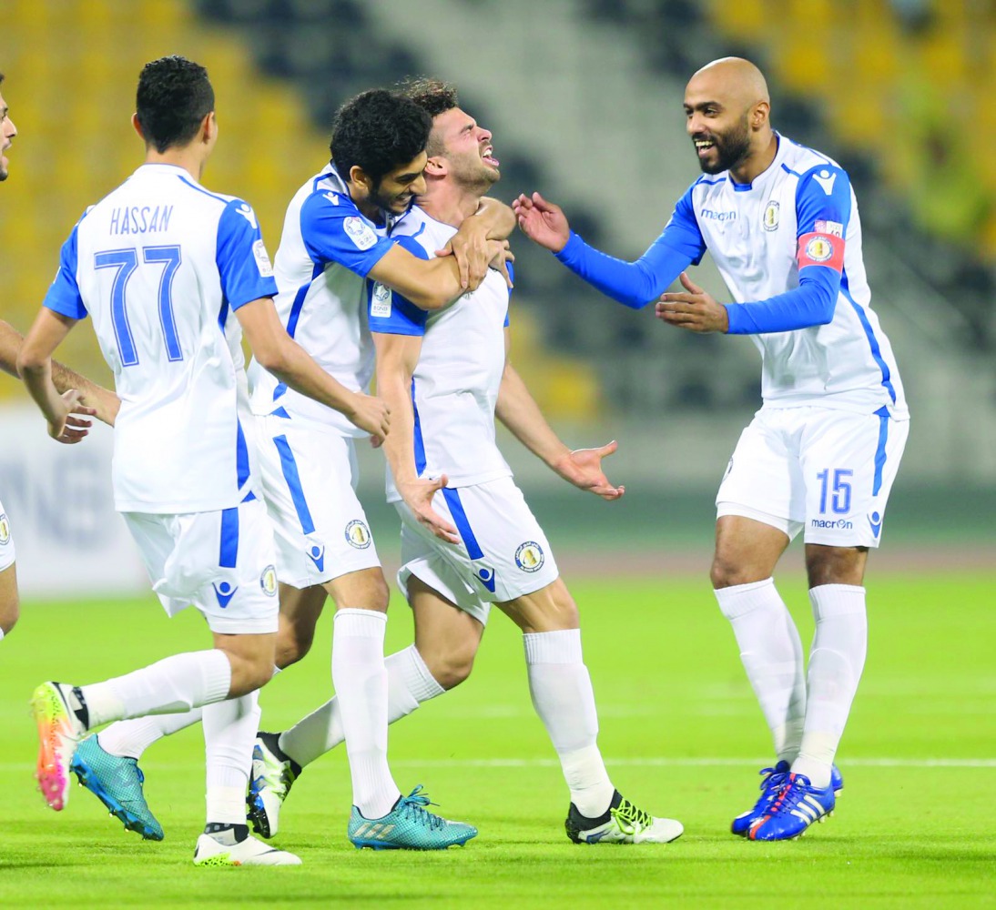 The players of Al Khor celebrate after scoring a goal in this file picture.