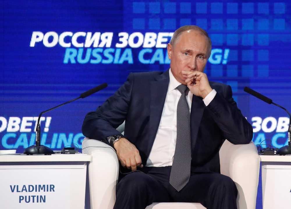 Russian President Vladimir Putin attends a session of the VTB Capital Investment Forum 