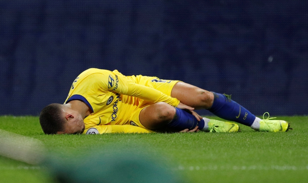 Chelsea's Eden Hazard reacts after sustaining an injury REUTERS/Phil Noble 