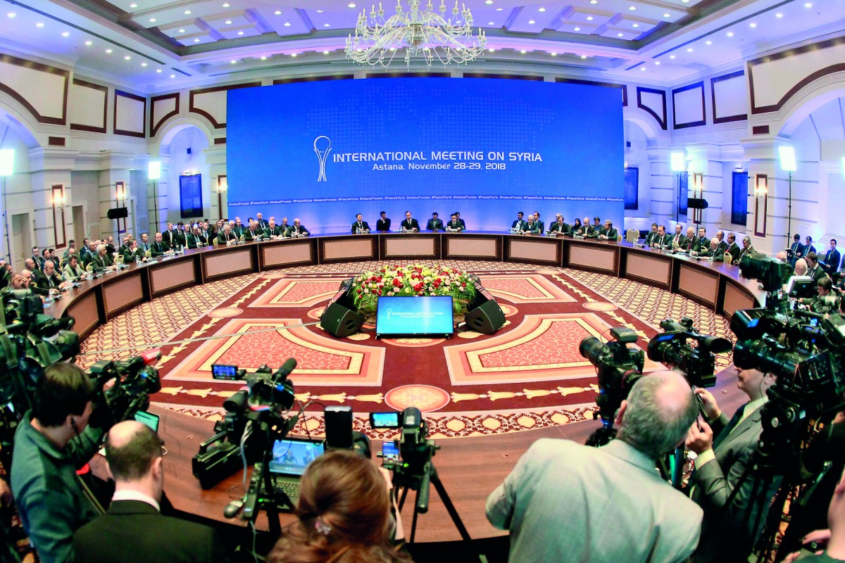 A general view shows Syrian regime representatives, opposition delegates and other attendees as they take part in the plenary session of Syria peace talks brokered by Iran, Russia and Turkey in Astana on November 29, 2018. AFP / Stanislav Filippov
