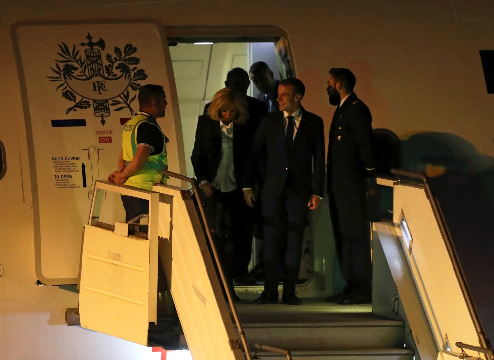 French President Emmanuel Macron and his wife Brigitte Macron arrive at Ministro Pistarini International Airport for the G20 leaders summit in Buenos Aires, Argentina November 28, 2018.  Reuters/Martin Acosta 
 