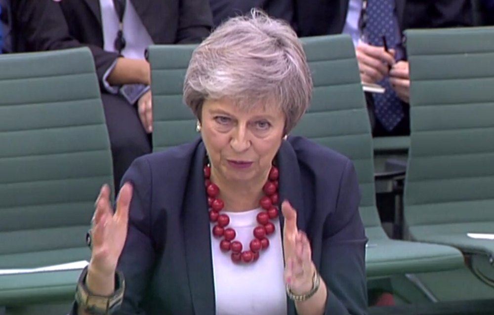 A video grab from footage broadcast by the UK Parliament's Parliamentary Recording Unit (PRU) shows Britain's Prime Minister Theresa May answer questions about her Brexit agenda by British MP's at a Parliamentary liaison committee meeting on November 29, 