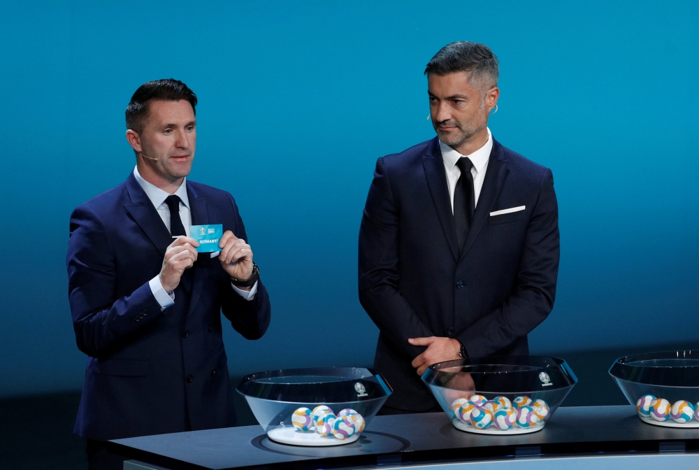 Former Republic of Ireland international Robbie Keane draws Germany. Reuters/John Sibley
