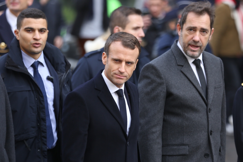 French President Emmanuel Macron (C) inspects the damages a day after clashes during a protest of Yellow vests (Gilets jaunes) against rising oil prices and living costs, in Paris, France on December 2, 2018. ( Zakaria Abdelkafi - Anadolu