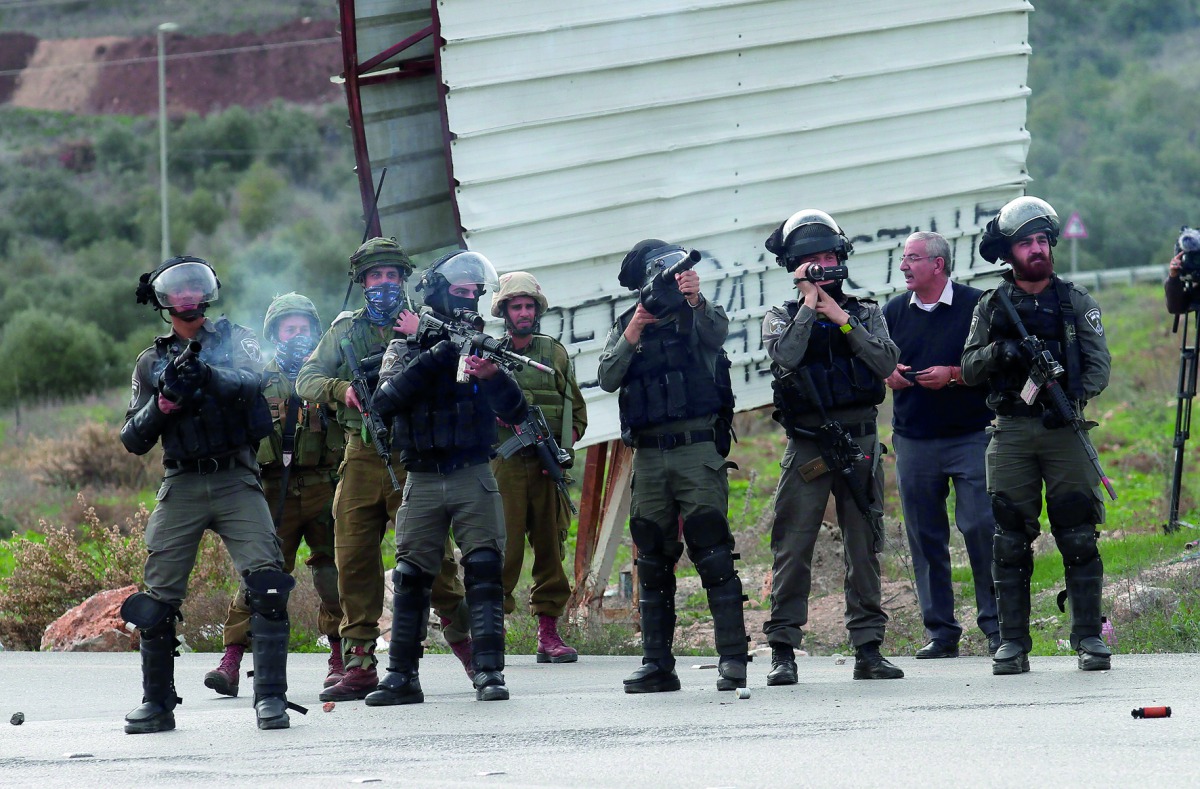 Israeli forces intervene to Palestinian demonstrators using tear gas and plastic bullets as Palestinians stage a protest against the detention of Fatah Movement officials in East Jerusalem, on December 02, 2018 in Nablus, West Bank. (Nedal Eshtayah/Anadol
