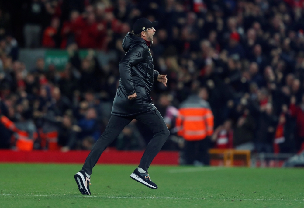 Liverpool manager Juergen Klopp runs onto the pitch celebrating their first goal scored by Liverpool's Divock Origi (not pictured) Action Images via Reuters/Lee Smith 