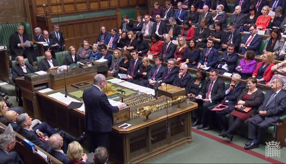A video grab from footage broadcast by the UK Parliament's Parliamentary Recording Unit (PRU) shows Britain's Attorney General Geoffrey Cox as he stands and delivers a statement on the Government's legal position on the Withdrawal Agreement, in the House 