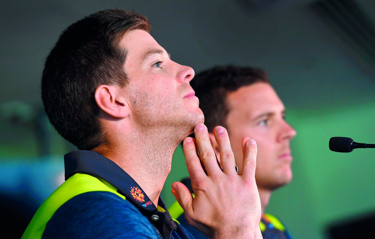 Australian cricket captain Tim Paine (L) and vice-captain Josh Hazlewood (R) listening to a quetion during a press conference in Melbourne on October 29, 2018. AFP / William West