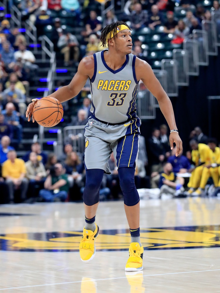 Myles Turner #33 of the Indiana Pacers dribbles the ball against the Chicago Bulls at Bankers Life Fieldhouse on December 4, 2018 in Indianapolis, Indiana. Andy Lyons/Getty Images/AFP
