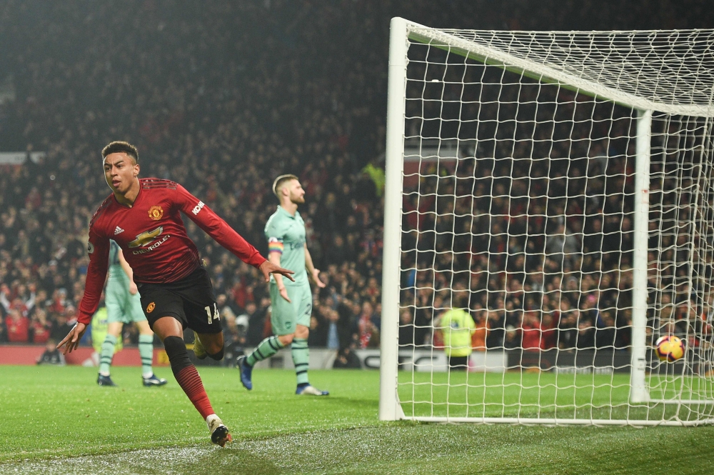 Manchester United's English midfielder Jesse Lingard celebrates scoring their second goal to equalise 2-2 during the English Premier League football match between Manchester United and Arsenal at Old Trafford in Manchester, north west England, on December