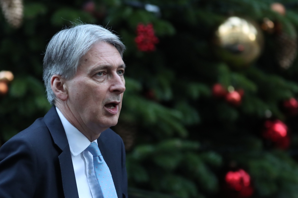 Britain's Chancellor of the Exchequer Philip Hammond attends the weekly meeting of the cabinet at 10 Downing Street in London on December 4, 2018. / AFP / Daniel LEAL-OLIVAS