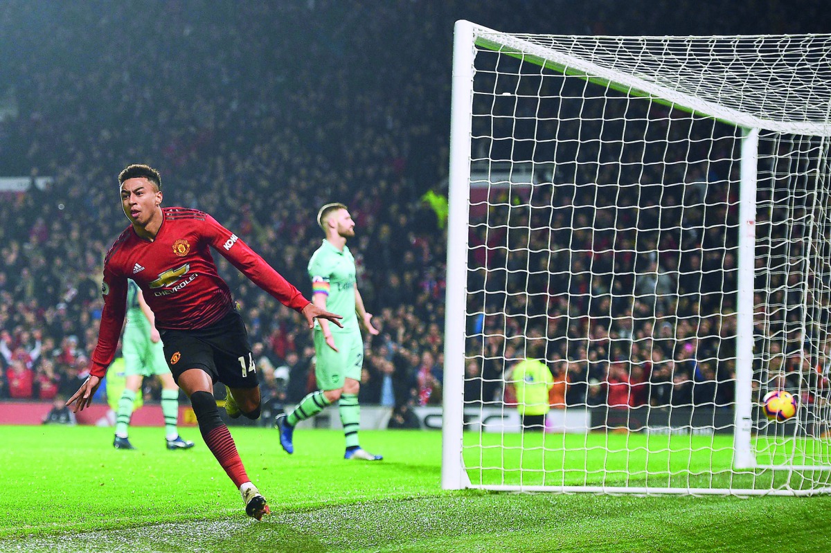 Manchester United's English midfielder Jesse Lingard celebrates scoring their second goal to equalise 2-2 during the English Premier League football match between Manchester United and Arsenal at Old Trafford in Manchester, north west England, on December