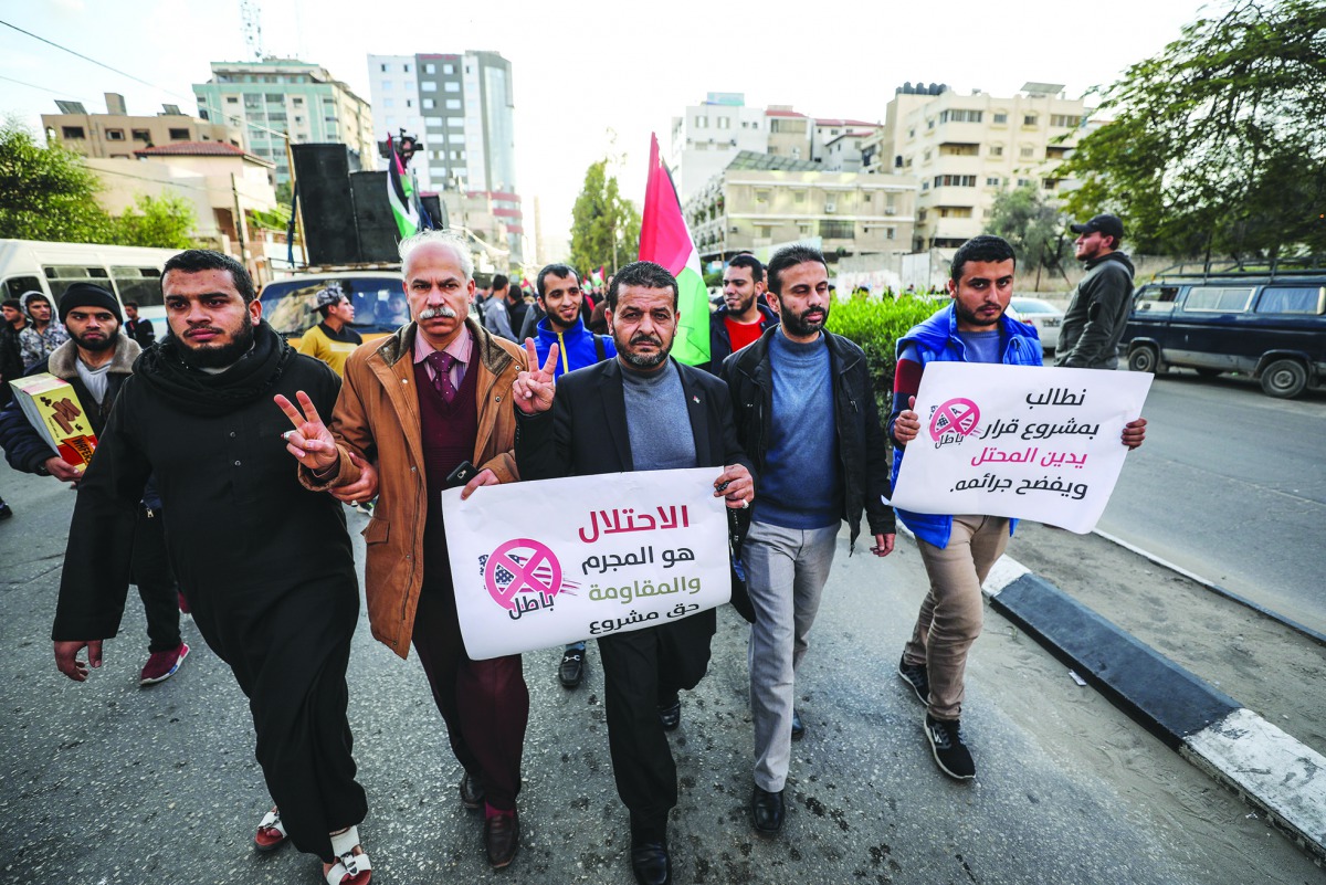 Palestinians gather to protest the US-sponsored draft resolution condemning Palestinian resistance group Hamas in General Assembly of the United Nations meeting in Gaza City, December 06, 2018. (Mustafa Hassona - Anadolu Agency)