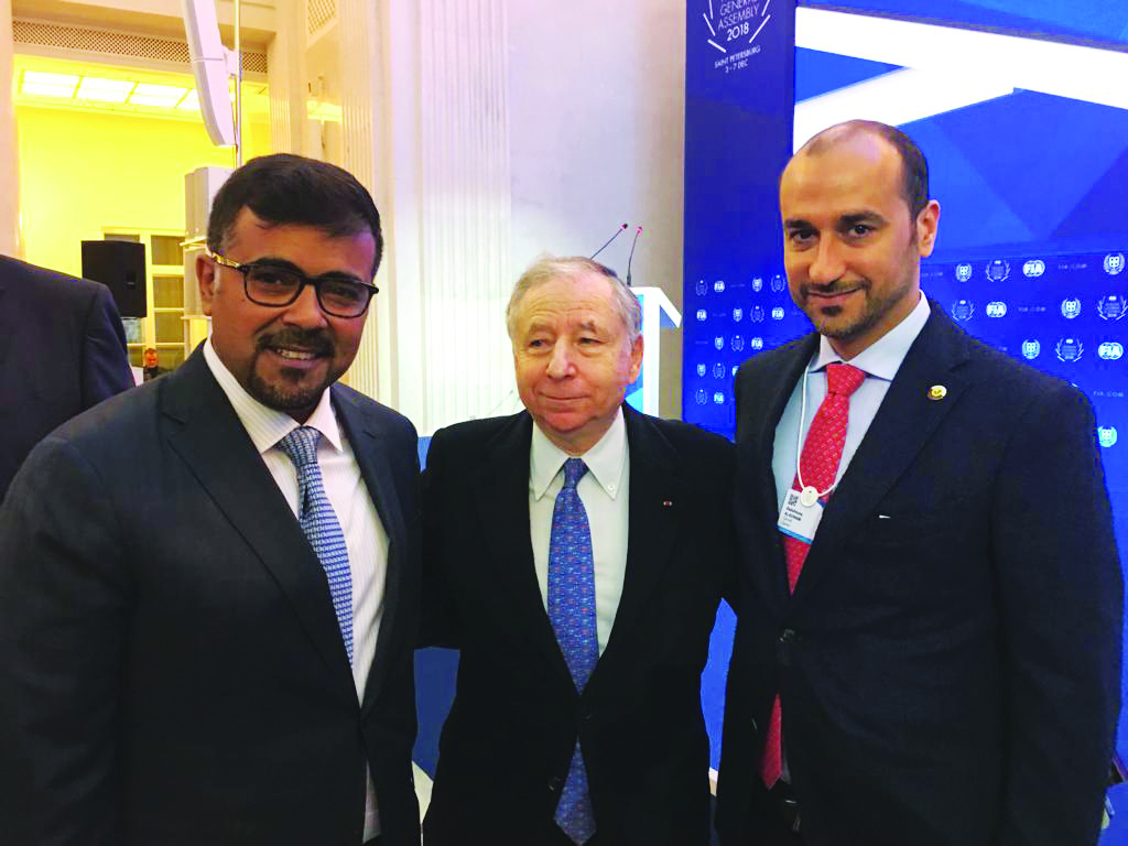 Qatar Motor and Motorcycle Federation (QMMF) President Abdulrahman Al Mannai (left) and QMMF Secretary General Abdul Razzaq Al Kuwari (right) pose for a photograph with FIA President Jean Todt during the FIA Council Meeting held in Saint Petersburg, Russi