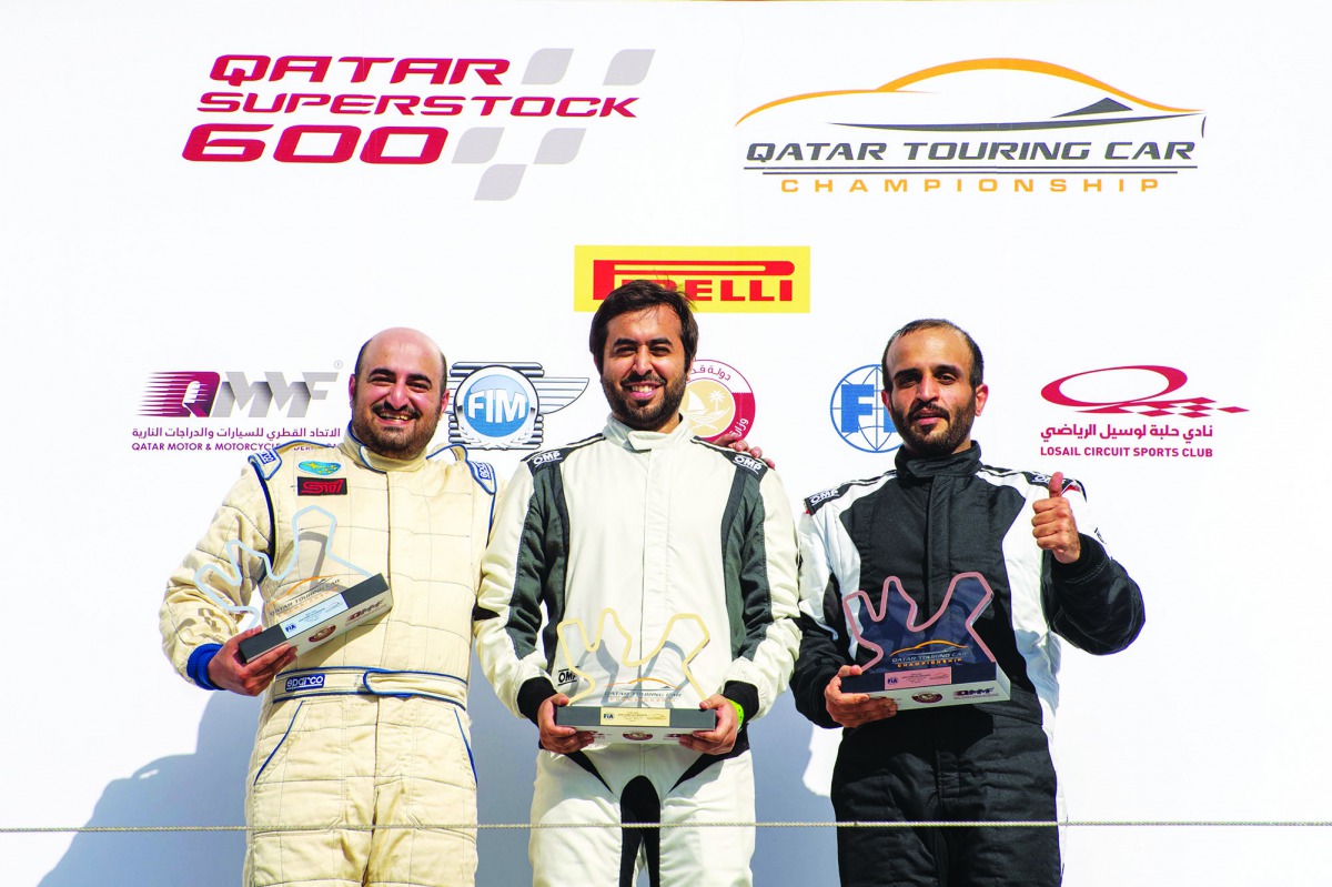 LEFT: Qatar’s Abdulla Al Khelaifi (centre) poses on the podium along with 2nd-placed  Ahmed Al Asiri (left) and Hamad Al Sulaiti, who finished third in the first race at Losail International Circuit on Saturday.  
