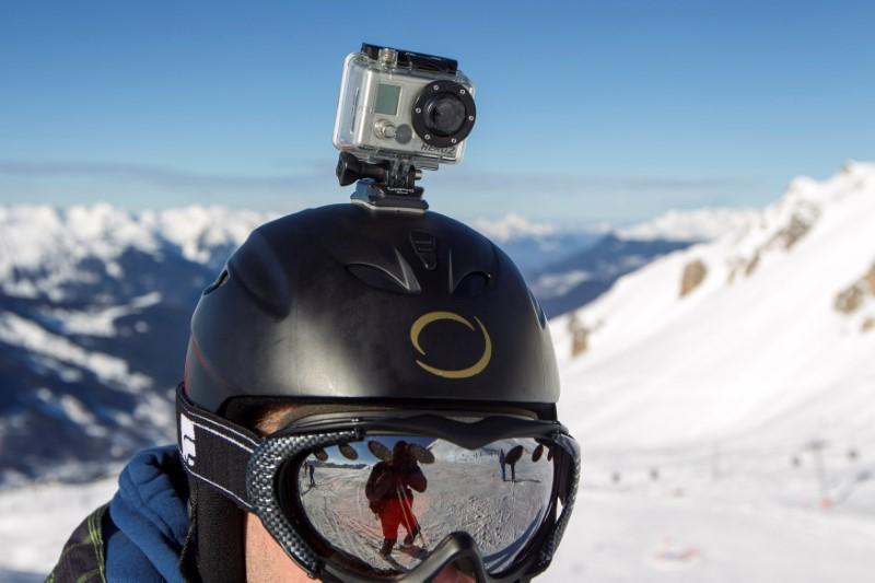 A GoPro camera is seen on the helmet of a skier as he rides down the slopes in the ski resort of Meribel, French Alps January 7, 2014. Reuters/Emmanuel Foudrot