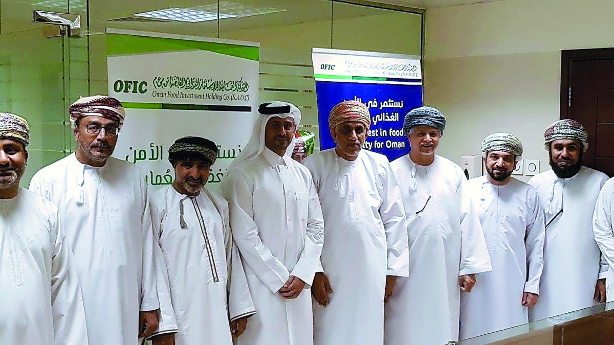The officials and dignitaries posing for a group picture after the signing ceremony in Muscat.