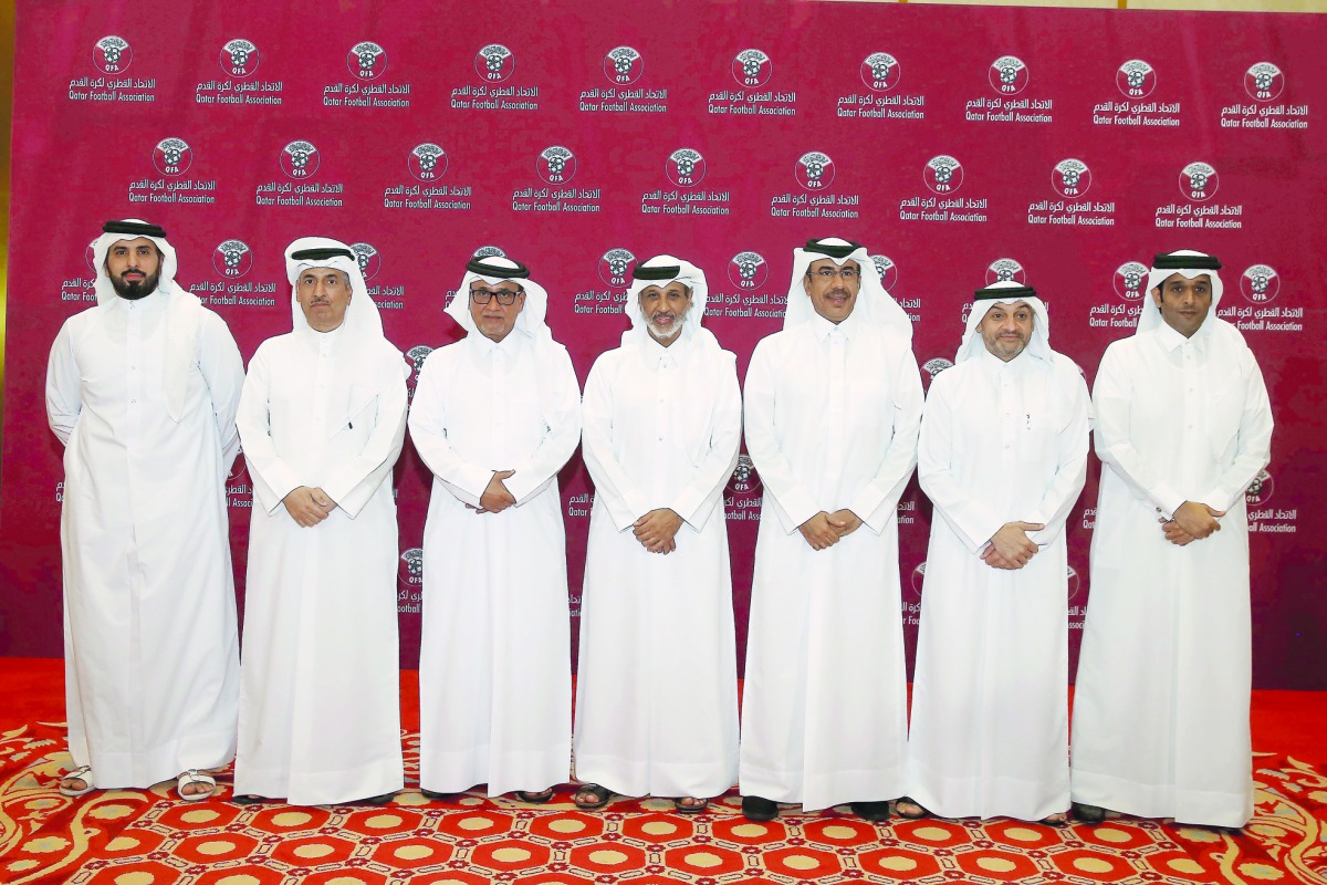 The President of Qatar Football Association Sheikh Hamad bin Khalifa bin Ahmed Al Thani poses for a picture with other Executive Committee members after his re-election in Doha yesterday.