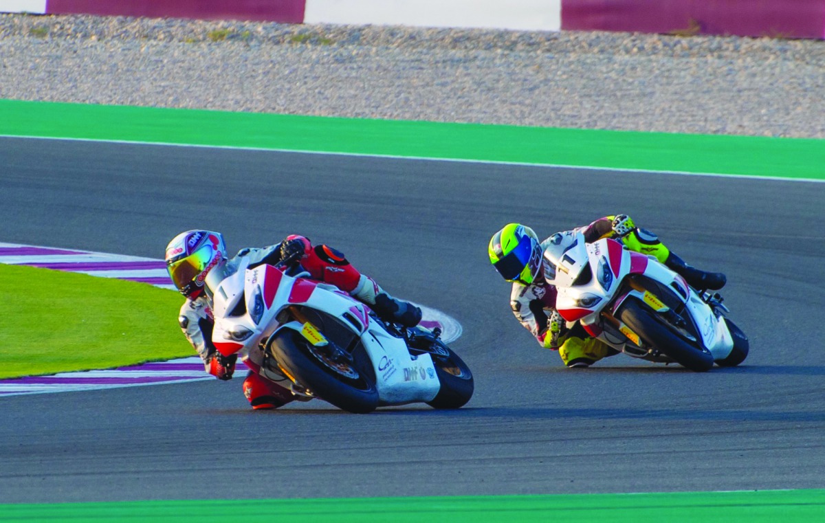 The defending Qatar Superstock 600 champion, Qatar’s Saeed Al Sulaiti (left) is closely followed by Abdulla Al Qubaisi during yesterday’s qualifying round at the Losail International Circuit.
