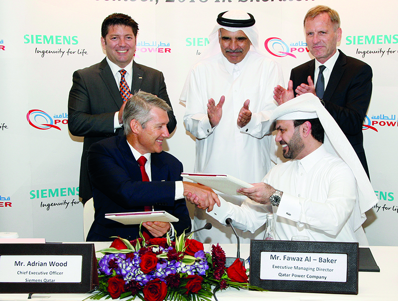 The Officials of Qatar Power company and Siemens during the signing ceremony.