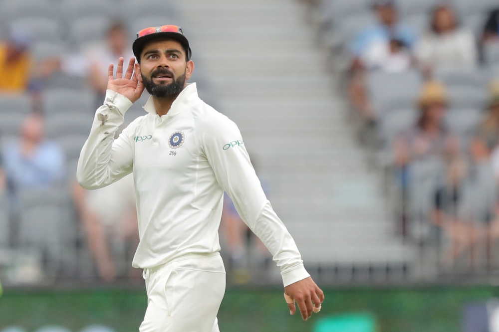 India's captain Virat Kohli gestures to the crowd on day three of the second test match between Australia and India at Perth Stadium in Perth, Australia, December 16, 2018. AAP/Richard Wainwright/via REUTERS