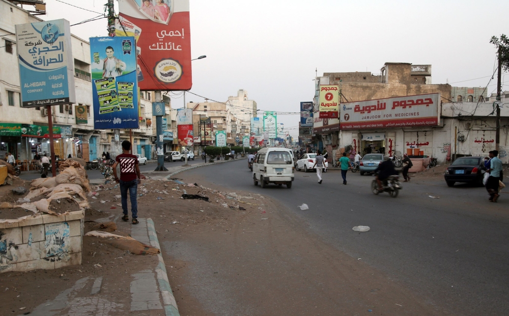 A picture taken on December 17, 2018 shows people driving in a market in the Huthi-held Red Sea port city of Hodeida. / AFP
