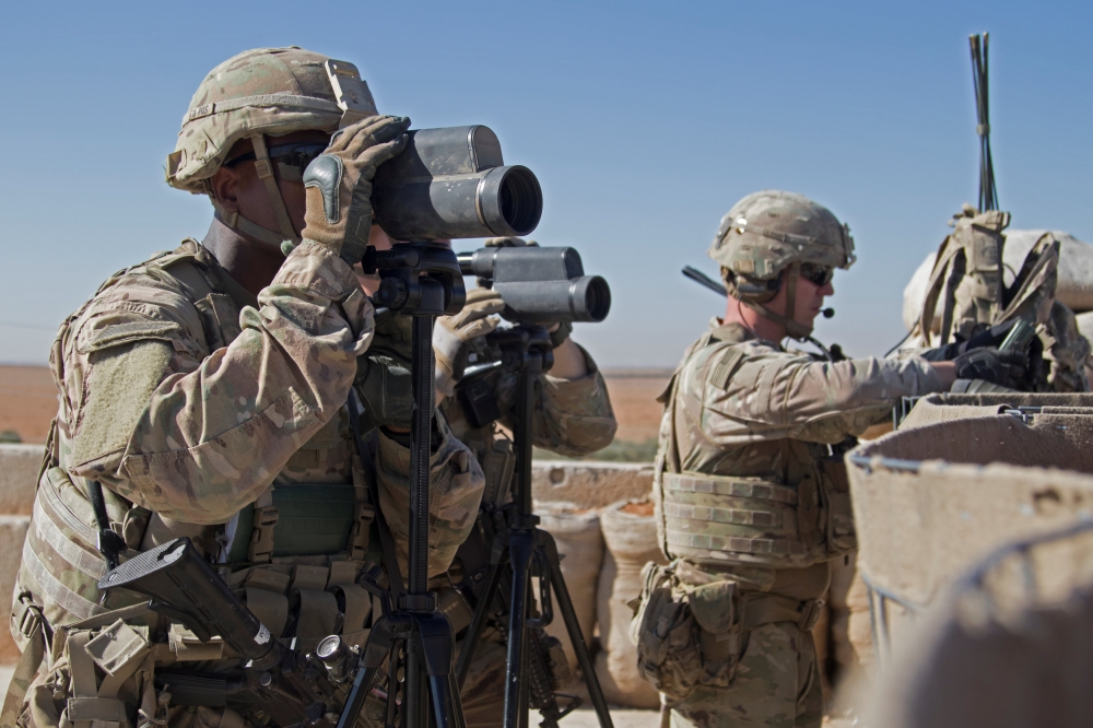 U.S. Soldiers surveil the area during a combined joint patrol in Manbij, Syria, November 1, 2018. Courtesy Zoe Garbarino/U.S. Army