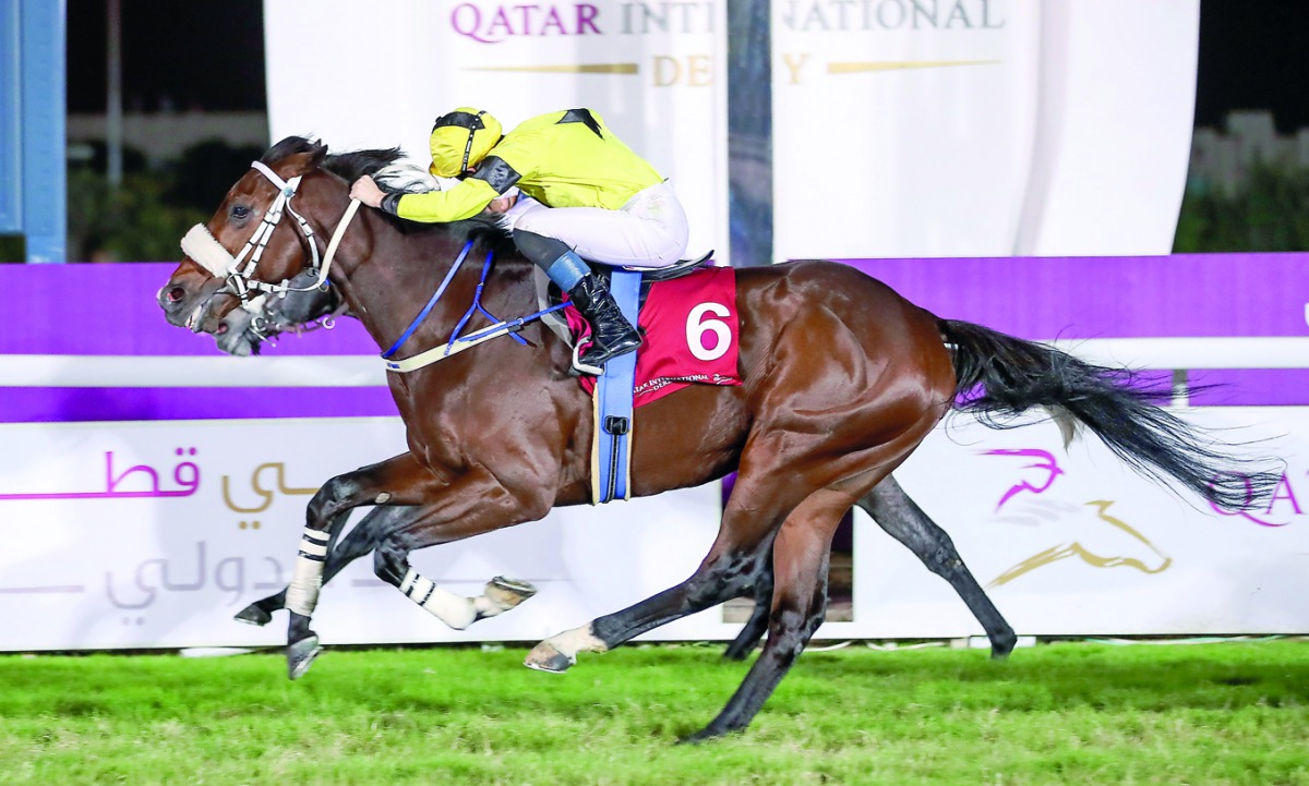 Full Moon, ridden by French jockey Ryan Curatolo, wins the Qatar Derby (Gr 1), in a photo-finish at QREC yesterday. 
