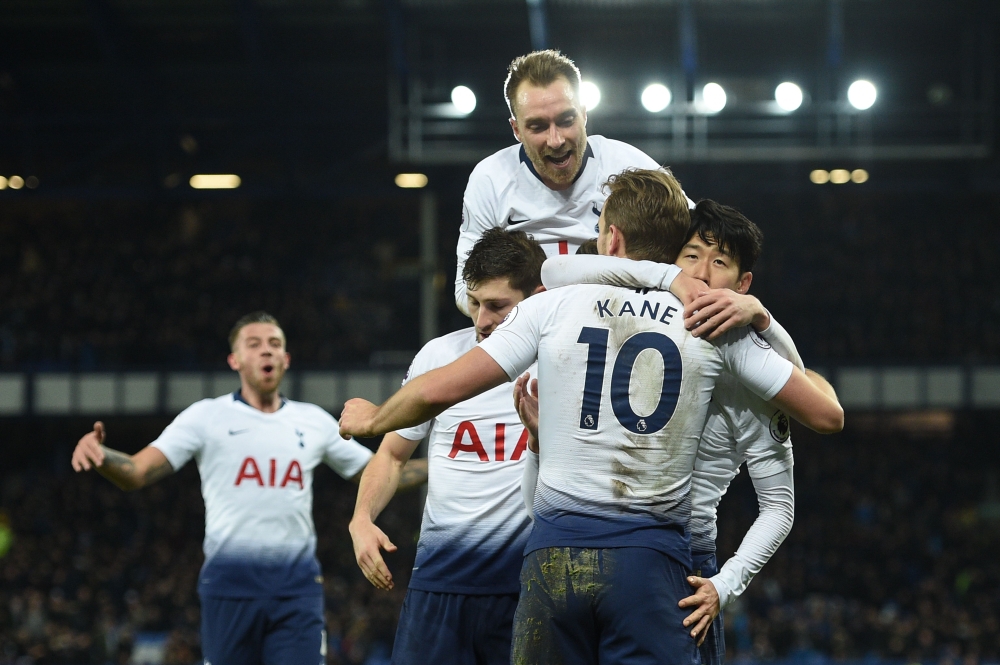 Tottenham Hotspur's English striker Harry Kane (C) with Tottenham Hotspur's South Korean striker Son Heung-Min (R) and Tottenham Hotspur's Danish midfielder Christian Eriksen (top) celebrates scoring their sixth goal during the English Premier League foot