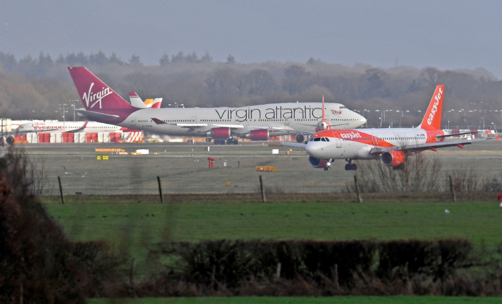 Aeroplanes taxi before and after taking-off and landing at Gatwick Airport, after the airport reopened to flights following its forced closure because of drone activity, in Gatwick, Britain, December 21, 2018. REUTERS/Toby Melville
