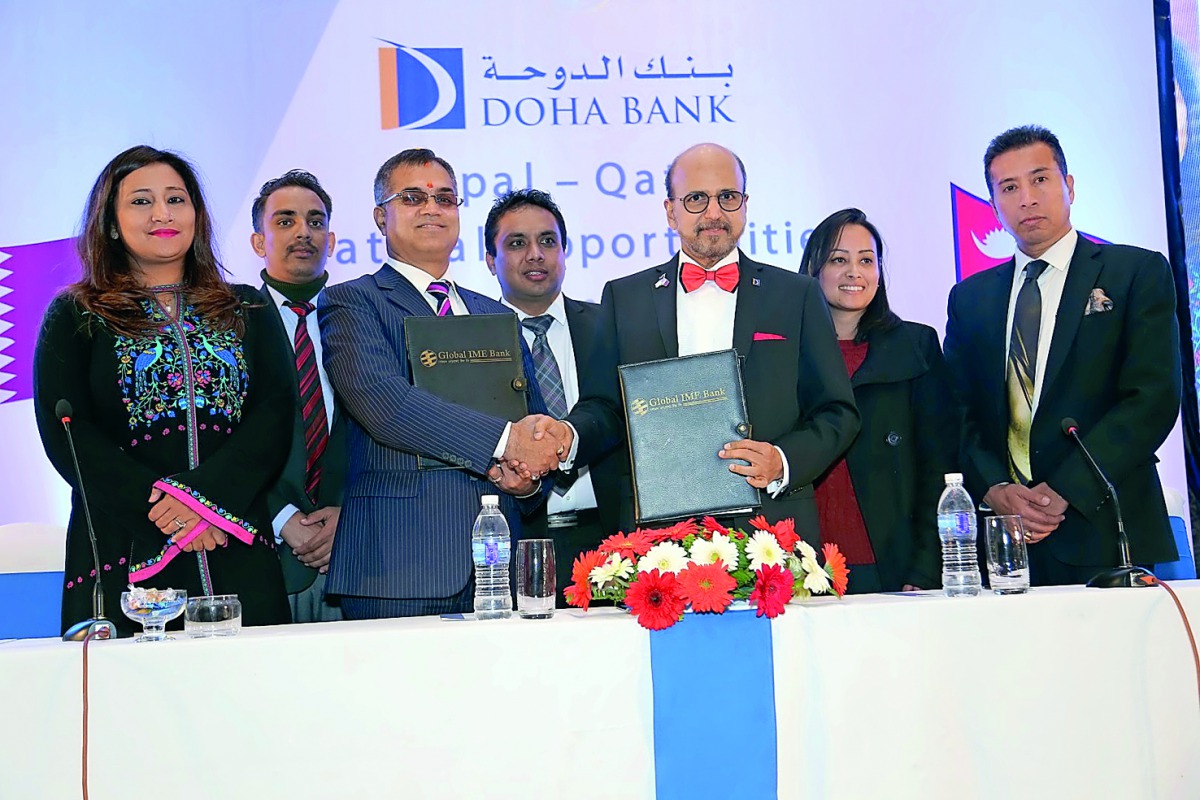 Dr R Seetharaman (third right), Chief Executive Officer of Doha Bank, shaking hands with Janak Sharma Poudyal, CEO of Global IME Bank, after signing the agreement in Kathmandu, Nepal, recently. 