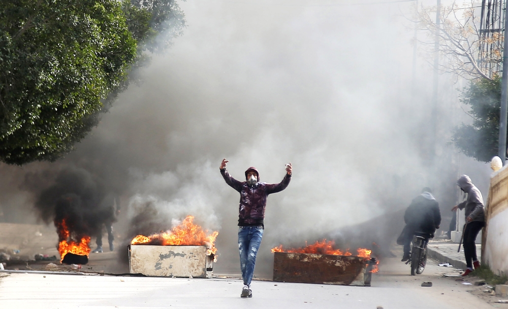 Protesters clash with riot police during demonstrations, in Kasserine, Tunisia December 25, 2018. REUTERS/Amine Ben Aziza