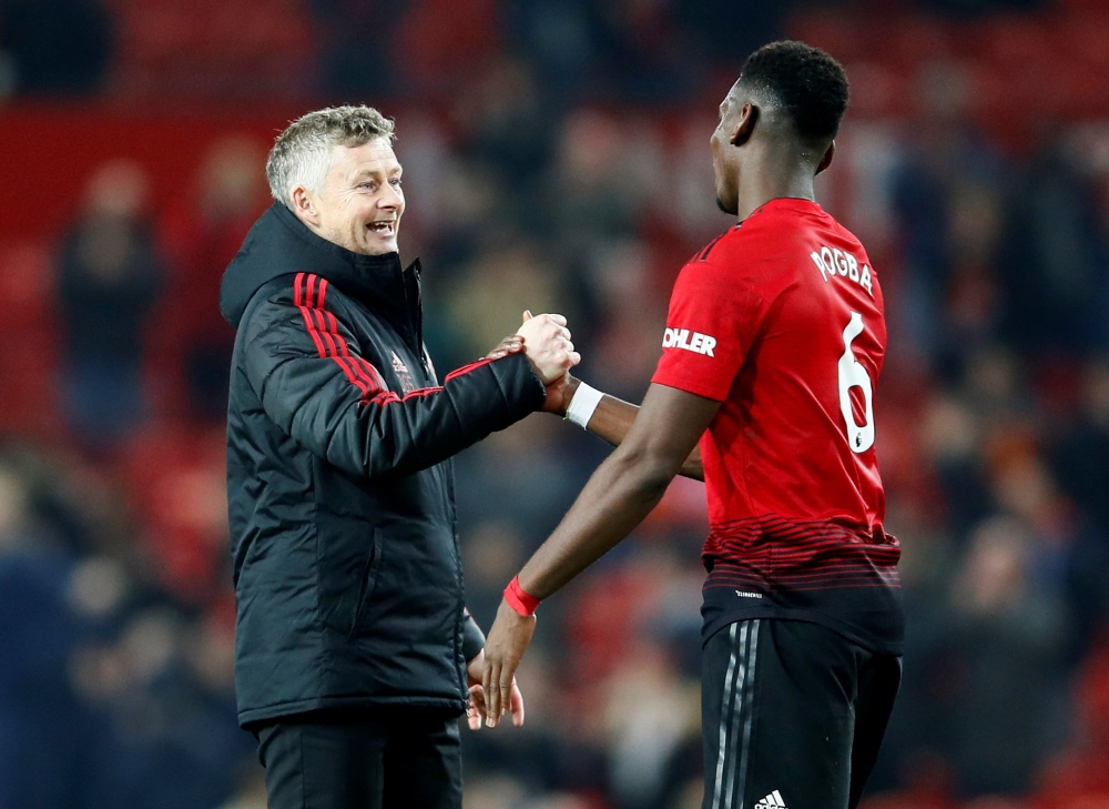 Manchester United's Paul Pogba and interim manager Ole Gunnar Solskjaer after the match Action Images via Reuters/Jason Cairnduff