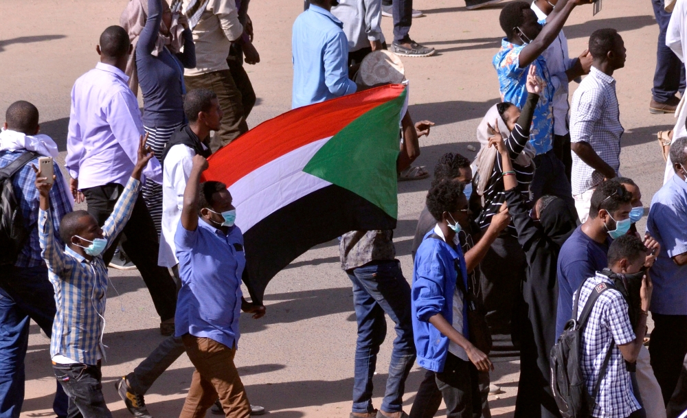 Sudanese demonstrators chant slogans as they march along the street during anti-government protests in Khartoum, Sudan December 25, 2018. REUTERS/Mohamed Nureldin Abdallah