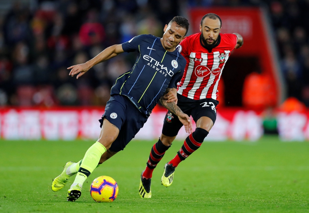Manchester City's Danilo in action with Southampton's Nathan Redmond. (REUTERS/Eddie Keogh)