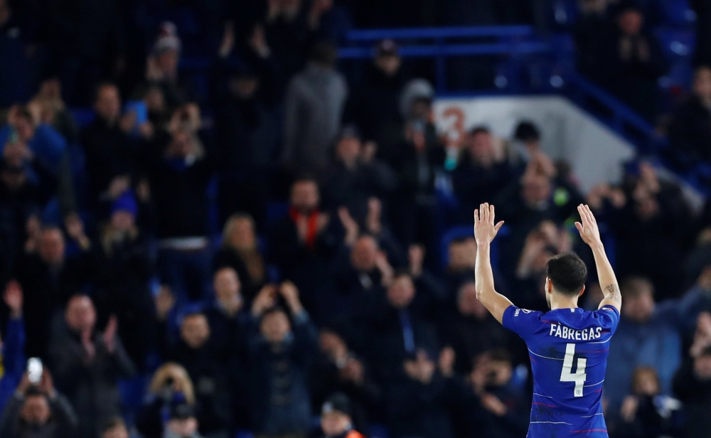Chelsea's Cesc Fabregas salutes their fans after the match REUTERS/Eddie Keogh