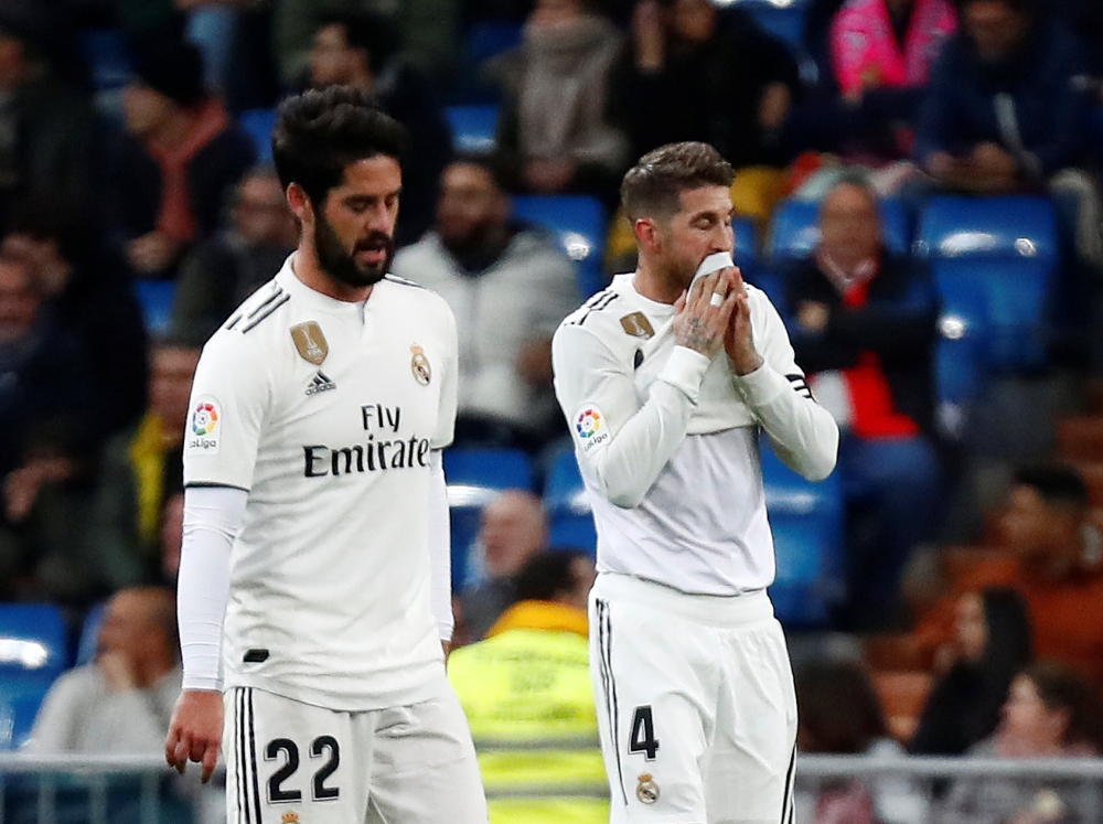 Real Madrid's Isco and Sergio Ramos react after conceding their second goal scored by Real Sociedad's Ruben Pardo REUTERS/Juan Medina