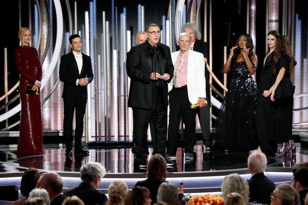 Graham King and Jim Beach (center R) accept the award for Bohemian Rhapsody, winner of Best Motion Picture, Drama. Paul Drinkwater/NBC Universal/Handout via REUTERS