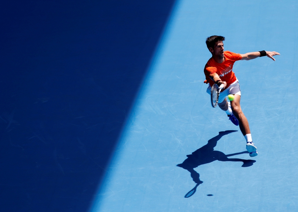 Serbia's Novak Djokovic at practice match against Britain's Andy Murray. REUTERS/Kim Kyung-Hoon