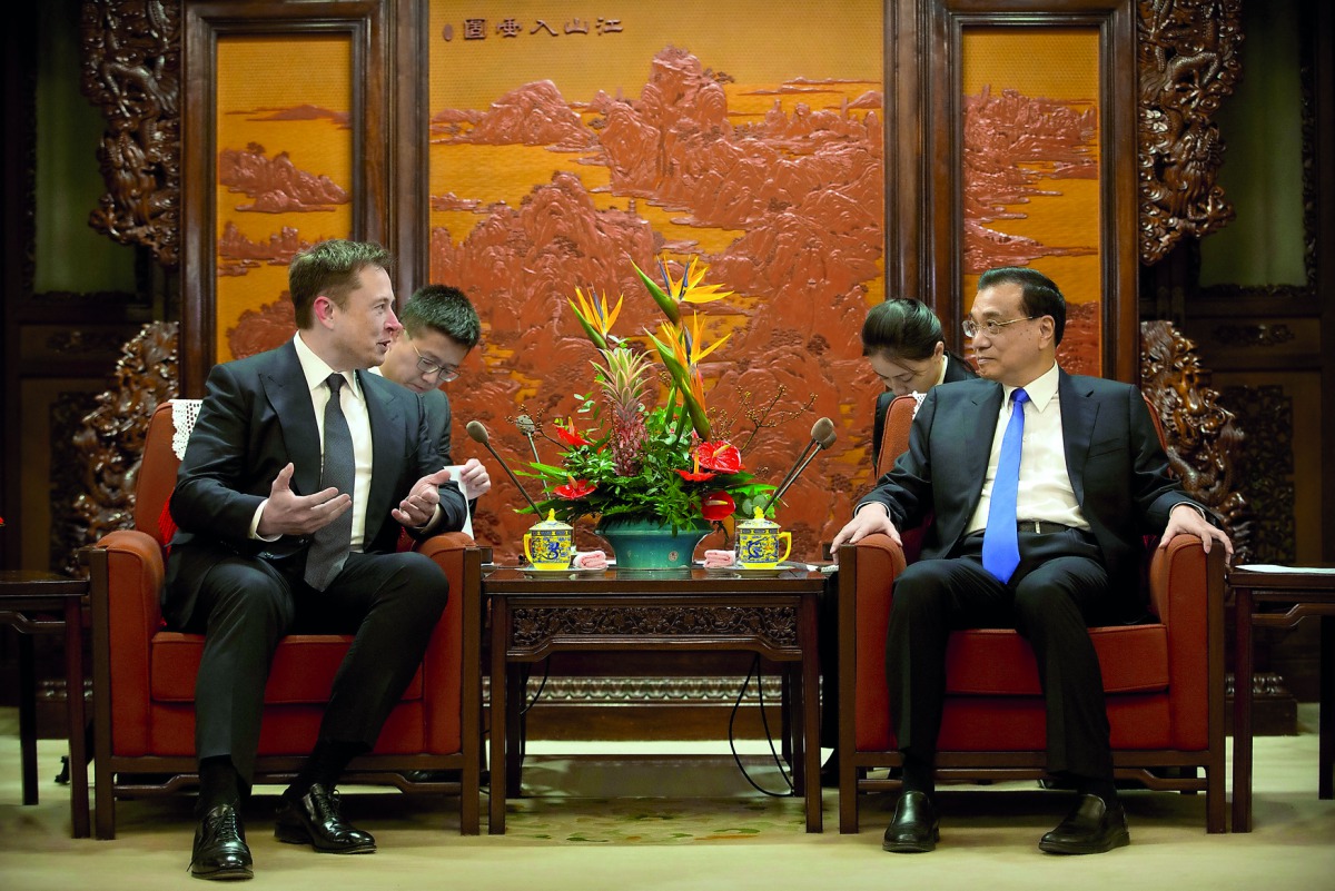 Tesla CEO Elon Musk speaks as Chinese Premier Li Keqiang listens during a meeting at the Zhongnanhai leadership compound in Beijing, China, January 9, 2019. Mark Schiefelbein/Pool via Reuters