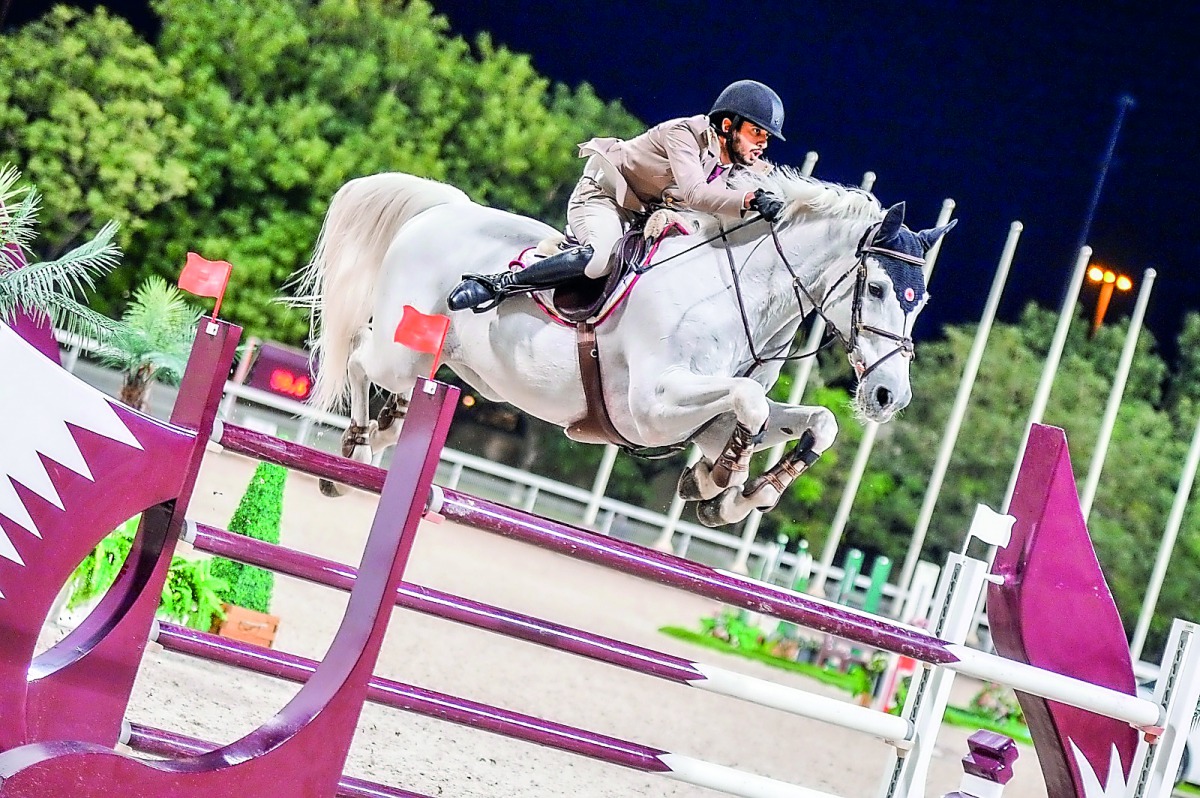 Salmeen Sultan Al Suwaidi clears an obstacle with Cantaro 32 during the Big Tour competition of round 6 of the Hathab Series yesterday.