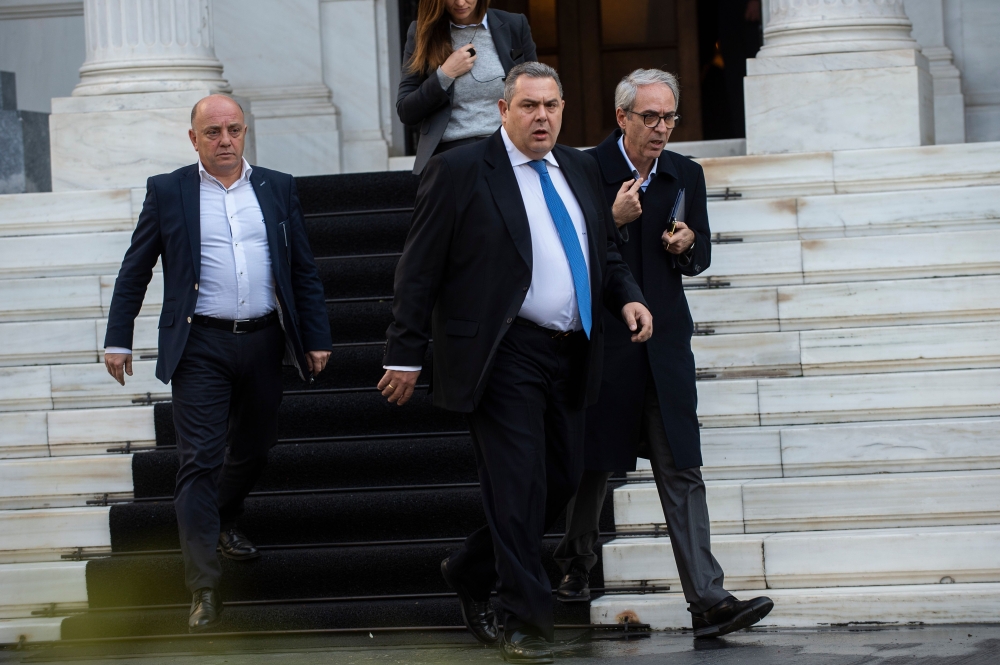 Greek Defense Minister and coalition partner Panos Kammenos leaves the Maximos Mansion after a meeting with Greek Prime Minister Alexis Tsipras in Athens on January 13, 2019. (AFP / ANGELOS )