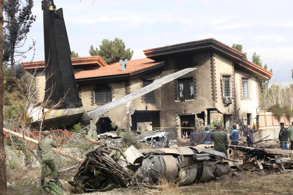 Wreckage is seen of a Boeing 707 military cargo plane which crashed on the west of the Iranian capital, near Fath airport, near Karaj, Iran, January 14, 2019. Abbas Shariati/Tasnim News Agency 