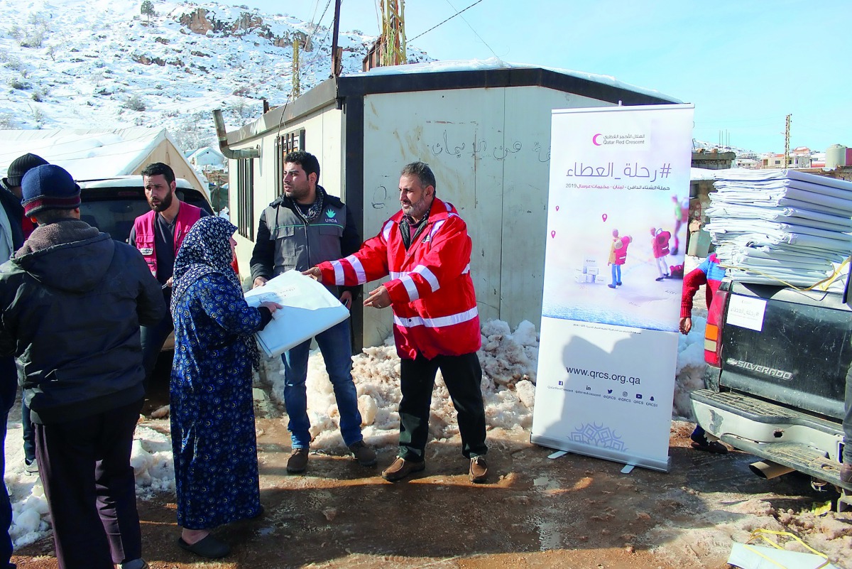 The representatives of QRCS are providing humanitarian aid to storm-affected Syrian refugees in Lebanon.