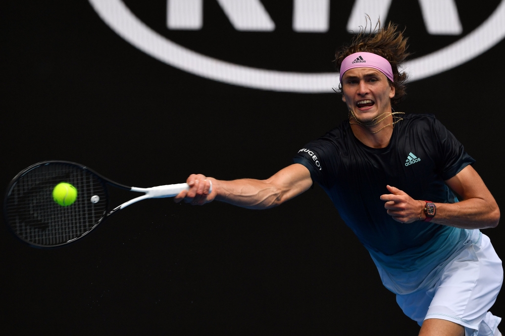 Germany's Alexander Zverev hits a return against Slovenia's Aljaz Bedene during their men's singles match on day two of the Australian Open tennis tournament in Melbourne on January 15, 2019. AFP / Paul Crock 