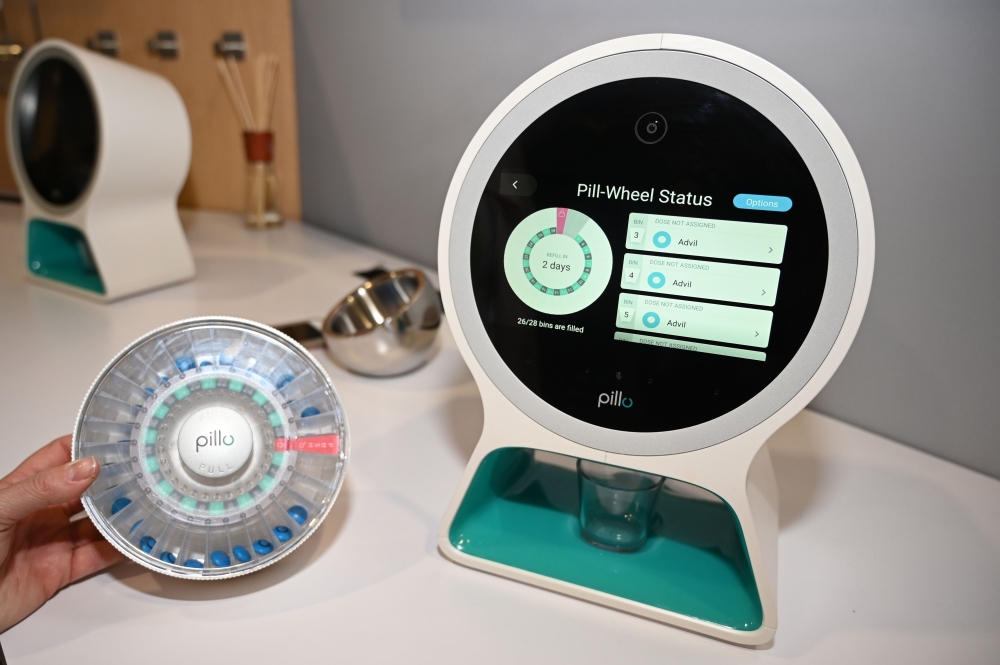 The Pillo, an all-in-one pill dispenser, personal digital assistant, and communication device is displayed CES 2019 consumer electronics show, on January 10, 2019 at the Las Vegas Convention Center in Las Vegas, Nevada. AFP / Robyn Beck
