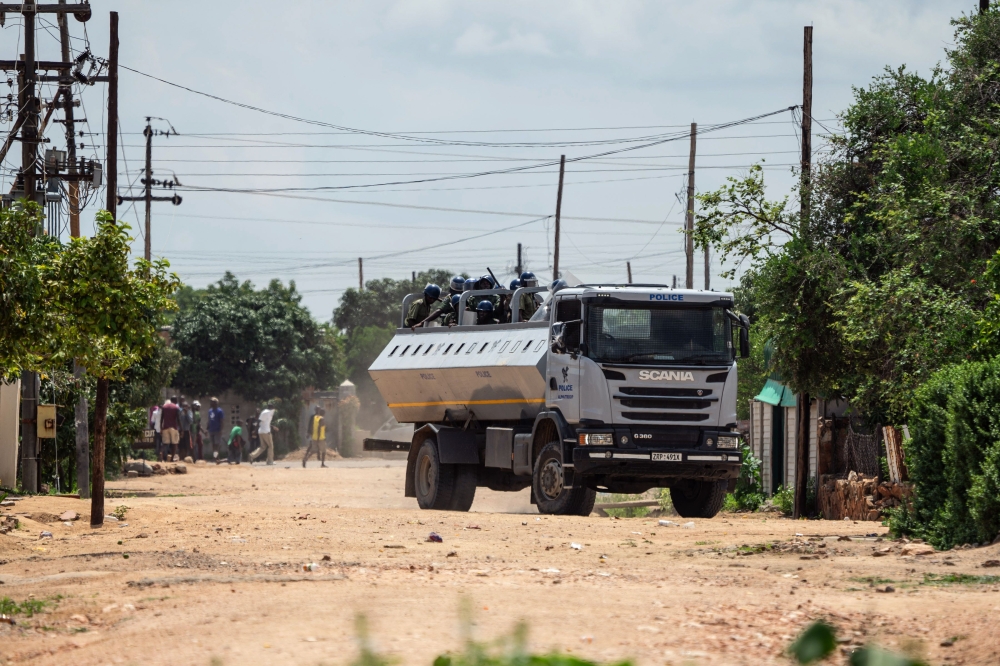 Anti-riot police stands on a truckload engaging in running battles with protestors in Emakhandeni township, Bulawayo, Zimbabwe on January 15, 2019. AFP / ZINYANGE AUNTONY